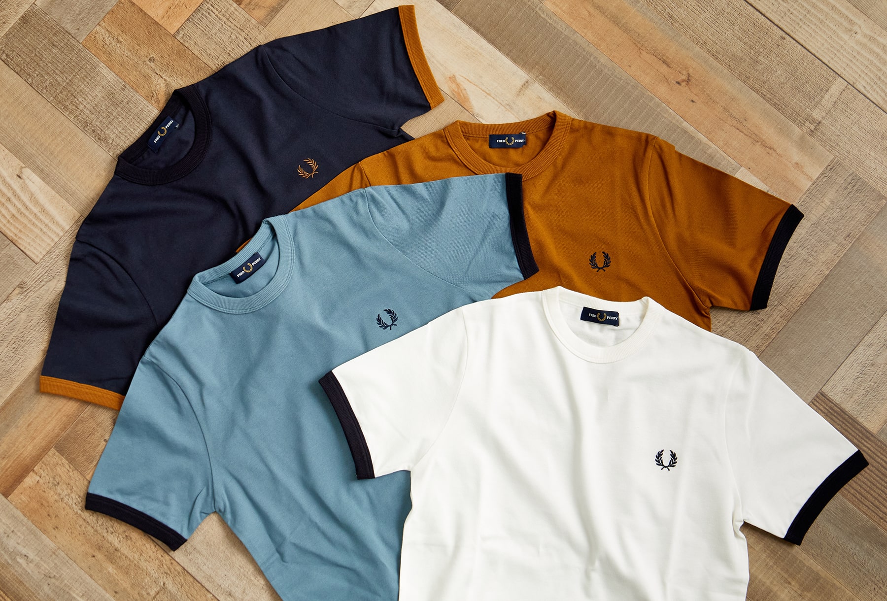 英国カルチャーの象徴 FRED PERRY(フレッドペリー)との別注Tシャツがリリース