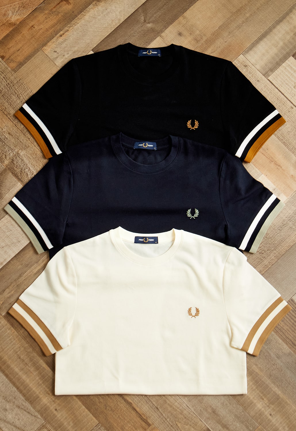 英国カルチャーの象徴 FRED PERRY(フレッドペリー)との別注Tシャツがリリース