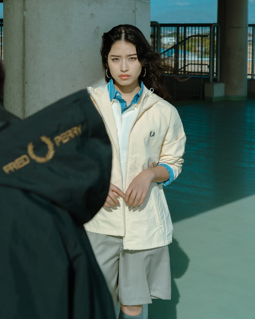 FRED PERRY [フレッドペリー] 別注 フード刺繍 ナイロンシェルジャケット [FPM-25A-031JF]です。