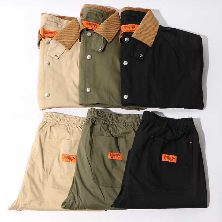 ユニバーサルオーバーオールのジーンスファクトリー別注のカバーオールとトラックイージーパンツです。