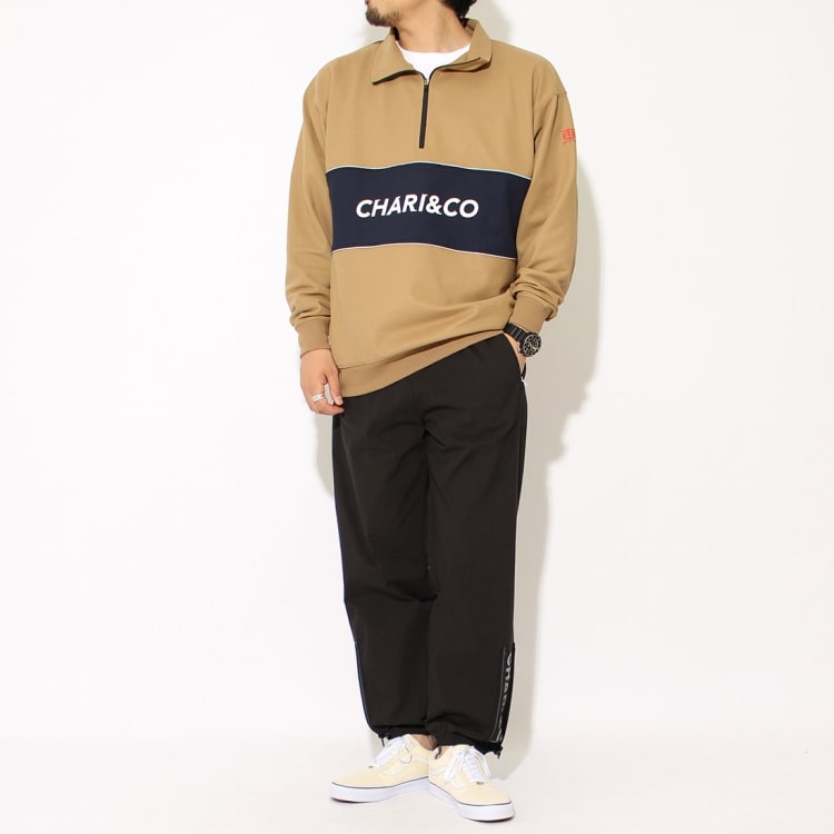 チャリアンドコーの333 HIGH NECK PULLOVER シャツとREFLECT BOLD LOGO トラックパンツです。